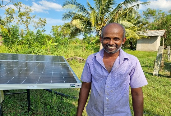 Sri Lankan dairy farmer with solar panels to power slurry pump