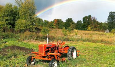 Tractor in a field after rain storm 