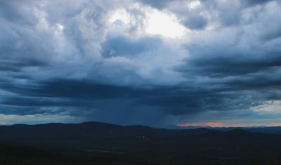 A rain storm approaches in the White Mountains.
