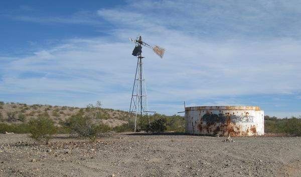 Broken windmill and water tank in Arizona