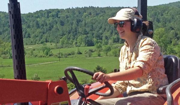 Vermont vegetable farmer on tractor